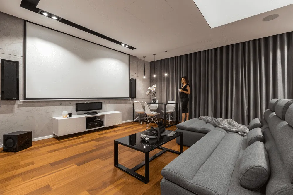Women standing in front of a projector