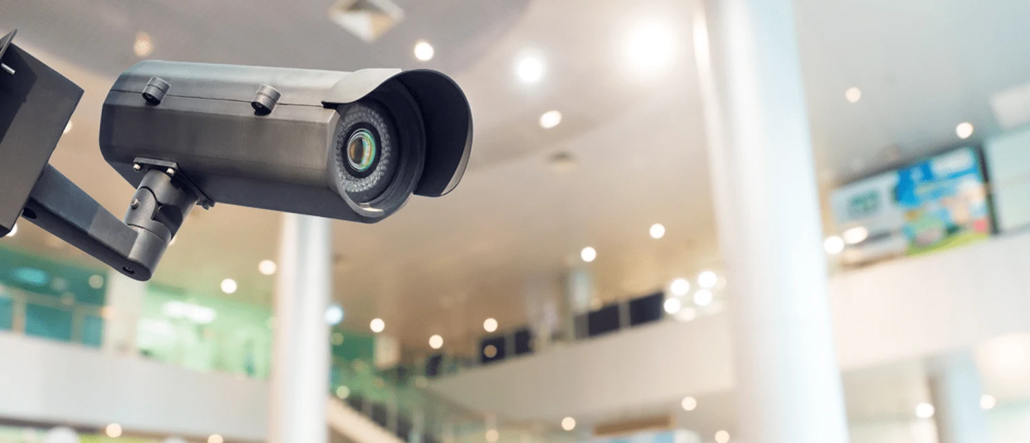 Black security camera in a modern building